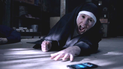 Agnes crawls towards Sam's phone to stop the exorcism. Agnes crawls towards Sam's phone to stop the exorcism.